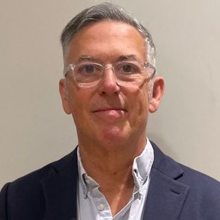 Man with glasses and blazer